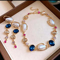 Set with irregular pearls, blue crystals and zirconia 2 PCS
