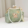Handcrafted clutch embroidered with a lotus flower