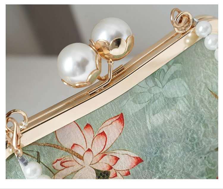Handcrafted clutch embroidered with a lotus flower