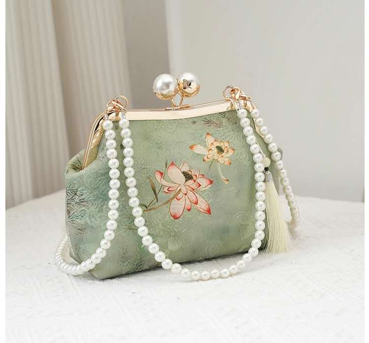 Handcrafted clutch embroidered with a lotus flower