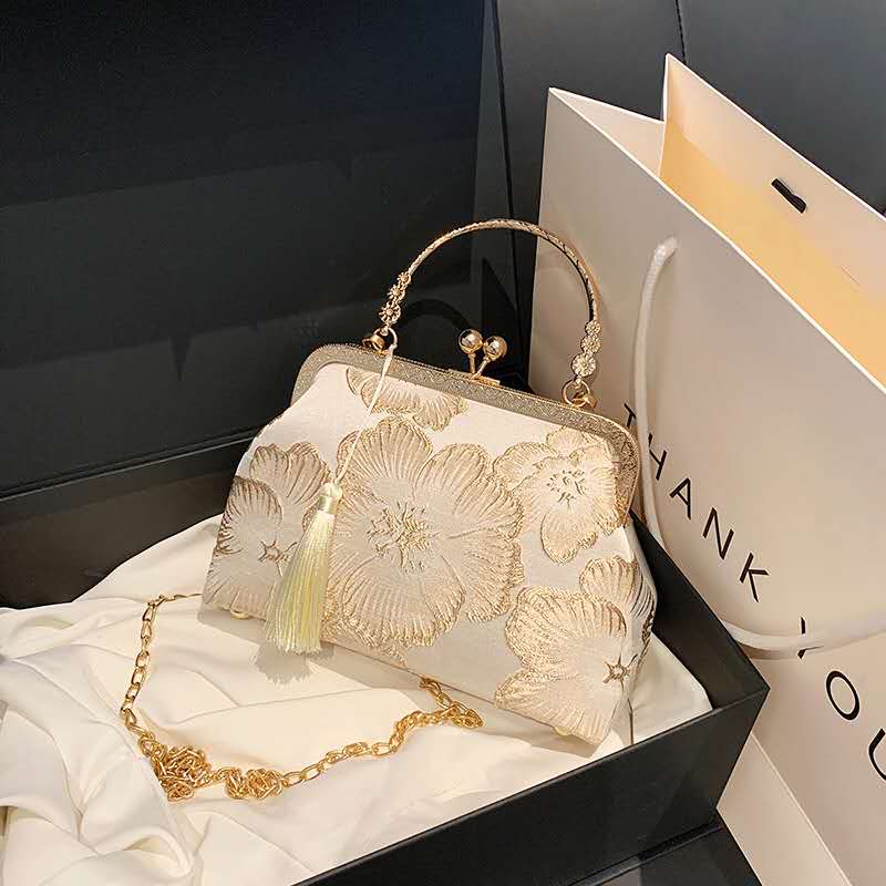 Handcrafted clutch embroidered with large floral motifs