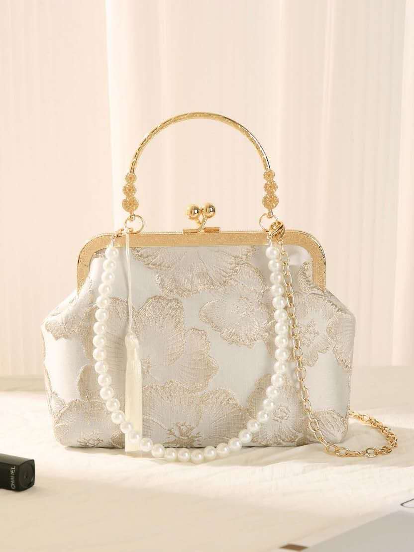 Handcrafted clutch embroidered with large floral motifs