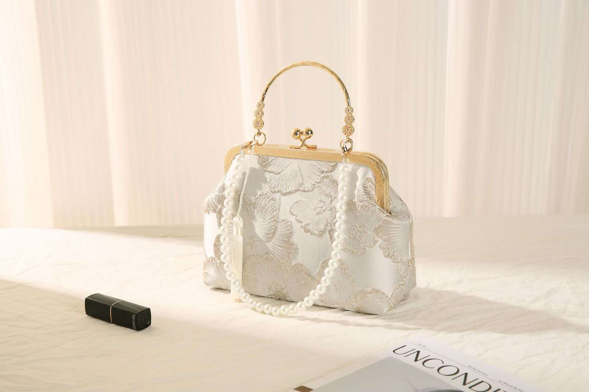Handcrafted clutch embroidered with large floral motifs