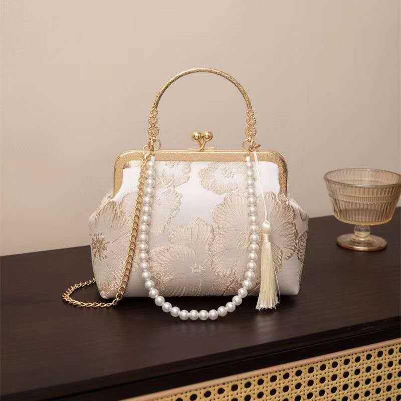 Handcrafted clutch embroidered with large floral motifs