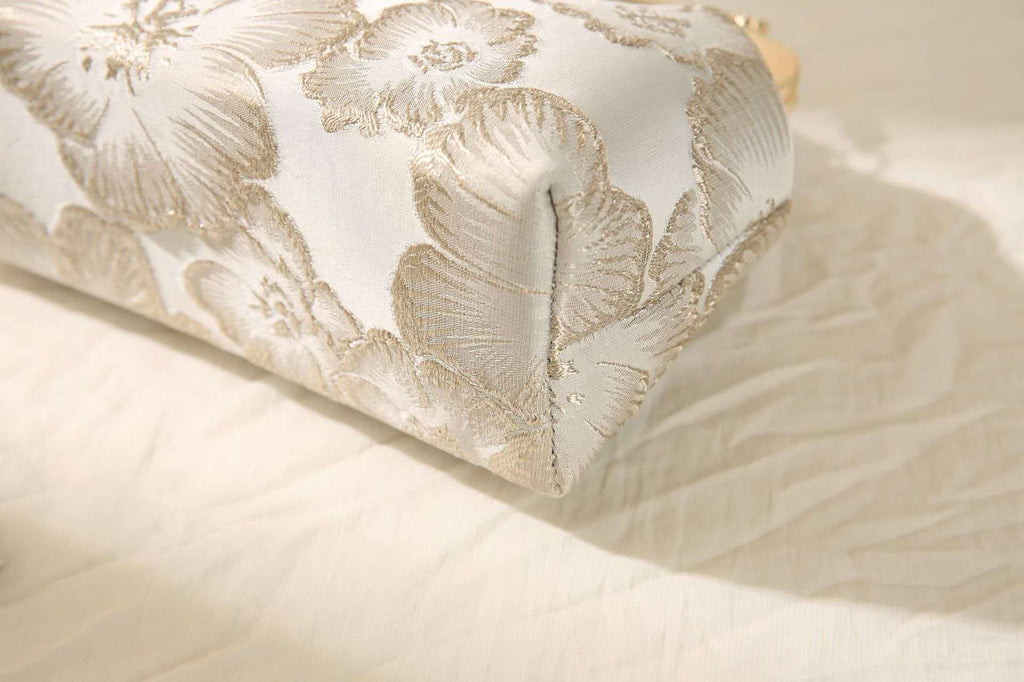 Handcrafted clutch embroidered with large floral motifs