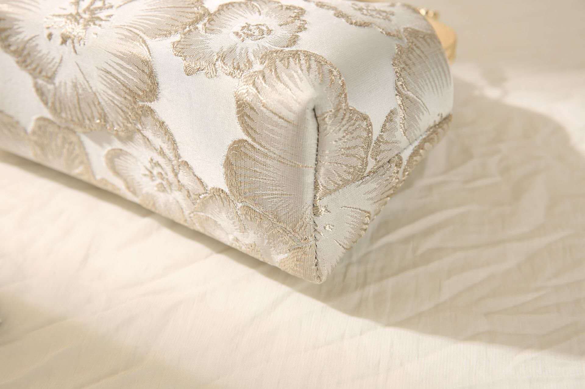 Handcrafted clutch embroidered with large floral motifs