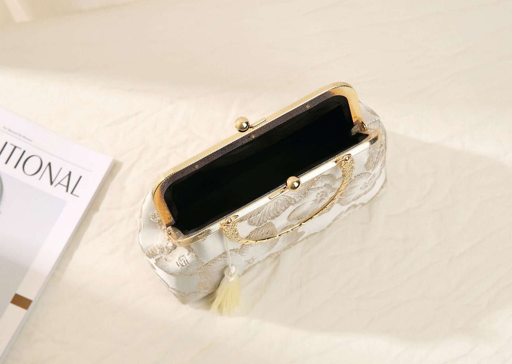 Handcrafted clutch embroidered with large floral motifs