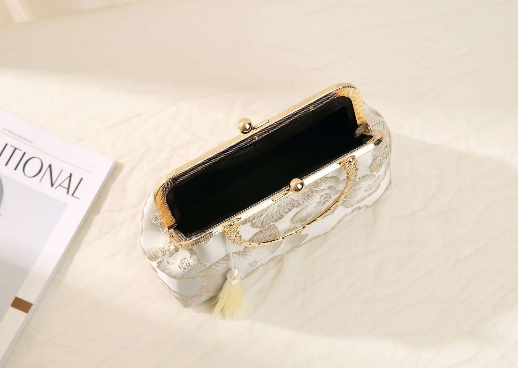 Handcrafted clutch embroidered with large floral motifs