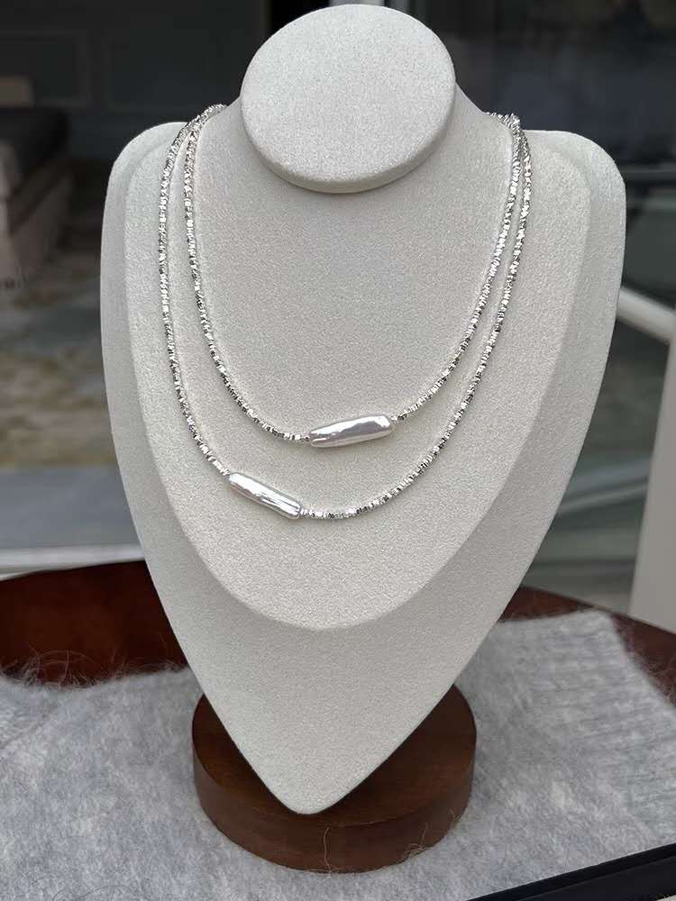 Necklace with crushed silver granules and irregular pearls