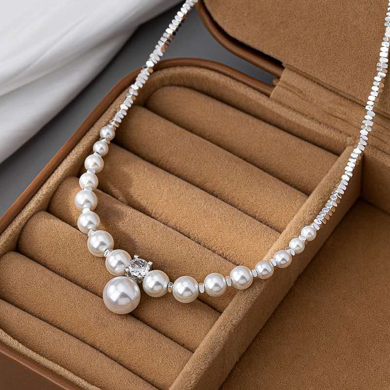 Necklace with crushed silver granules and irregular pearls