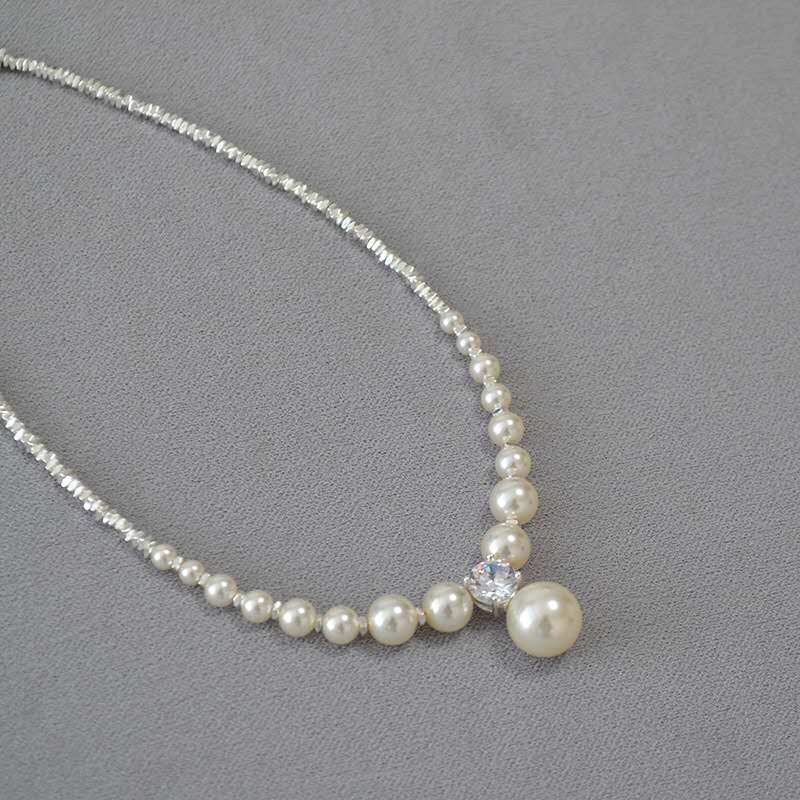 Necklace with crushed silver granules and irregular pearls