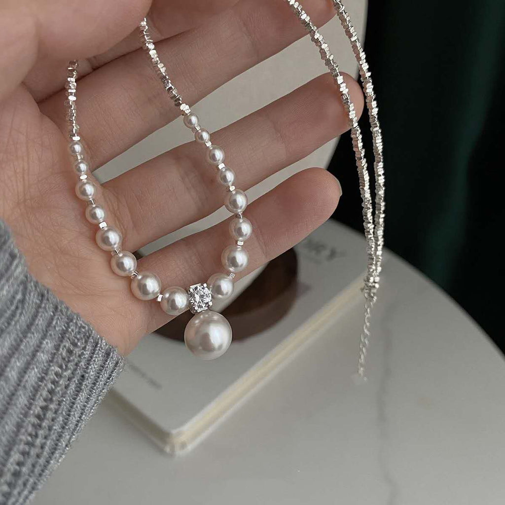 Necklace with crushed silver granules and irregular pearls