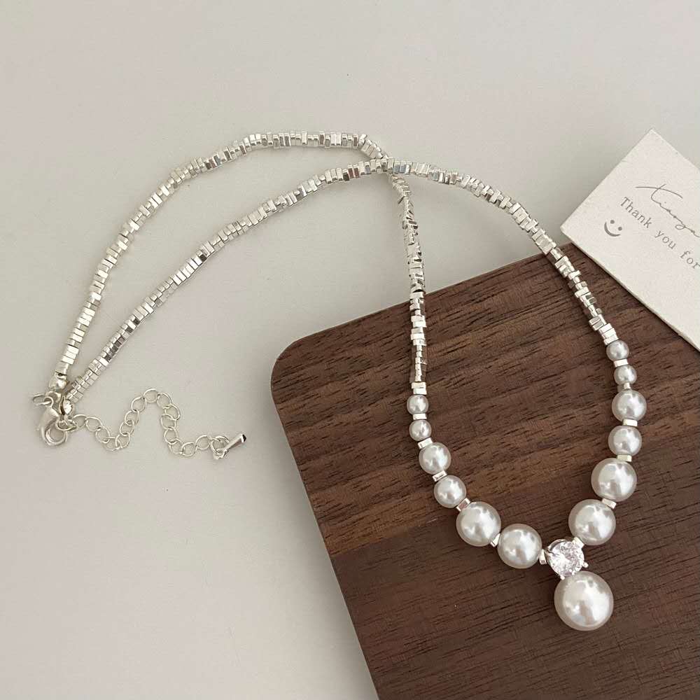 Necklace with crushed silver granules and irregular pearls