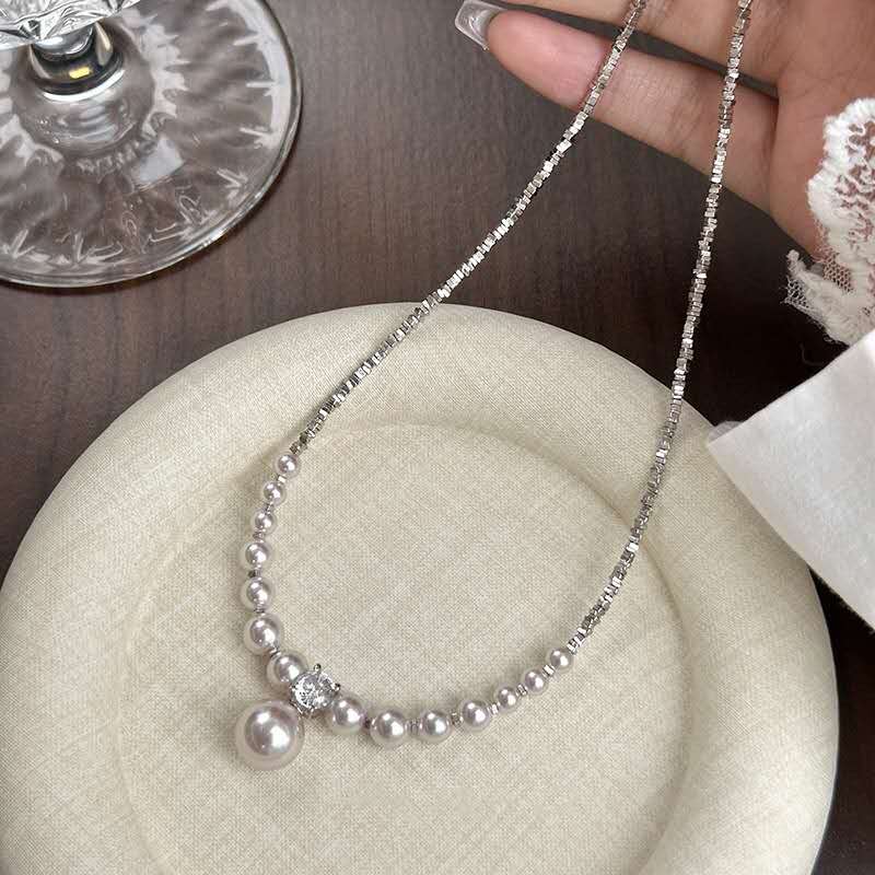 Necklace with crushed silver granules and irregular pearls
