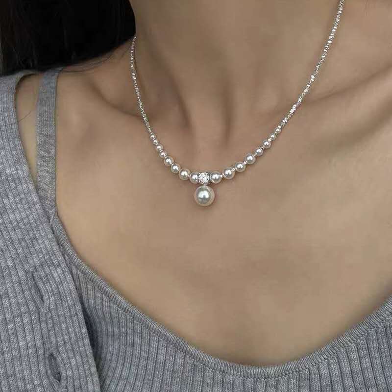 Necklace with crushed silver granules and irregular pearls