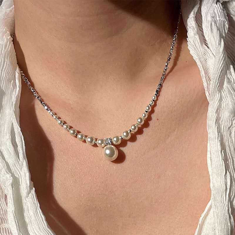 Necklace with crushed silver granules and irregular pearls