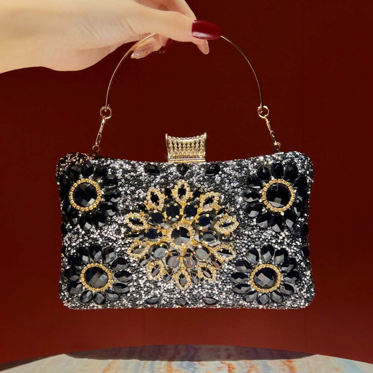 Elegant hard-shell clutch with cubic zirconia and rhinestones.