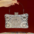 Elegant hard-shell clutch with cubic zirconia and rhinestones.