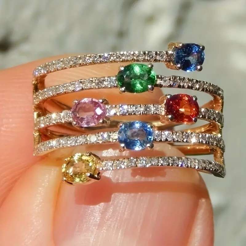 Multi-layered ring with rhinestones and colored cubic zirconia