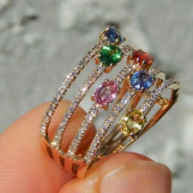Multi-layered ring with rhinestones and colored cubic zirconia