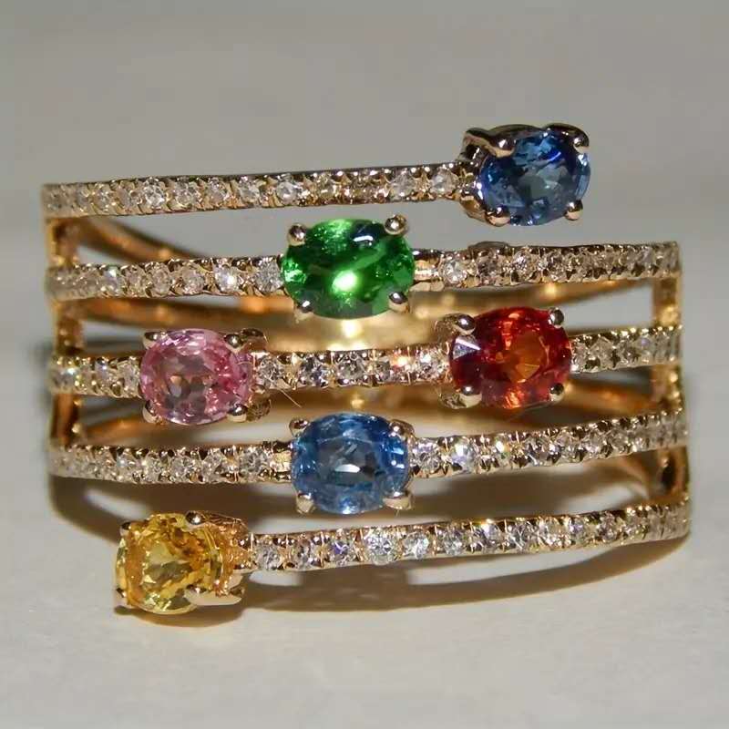 Multi-layered ring with rhinestones and colored cubic zirconia