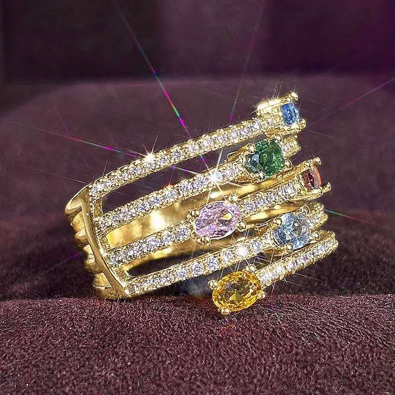 Multi-layered ring with rhinestones and colored cubic zirconia