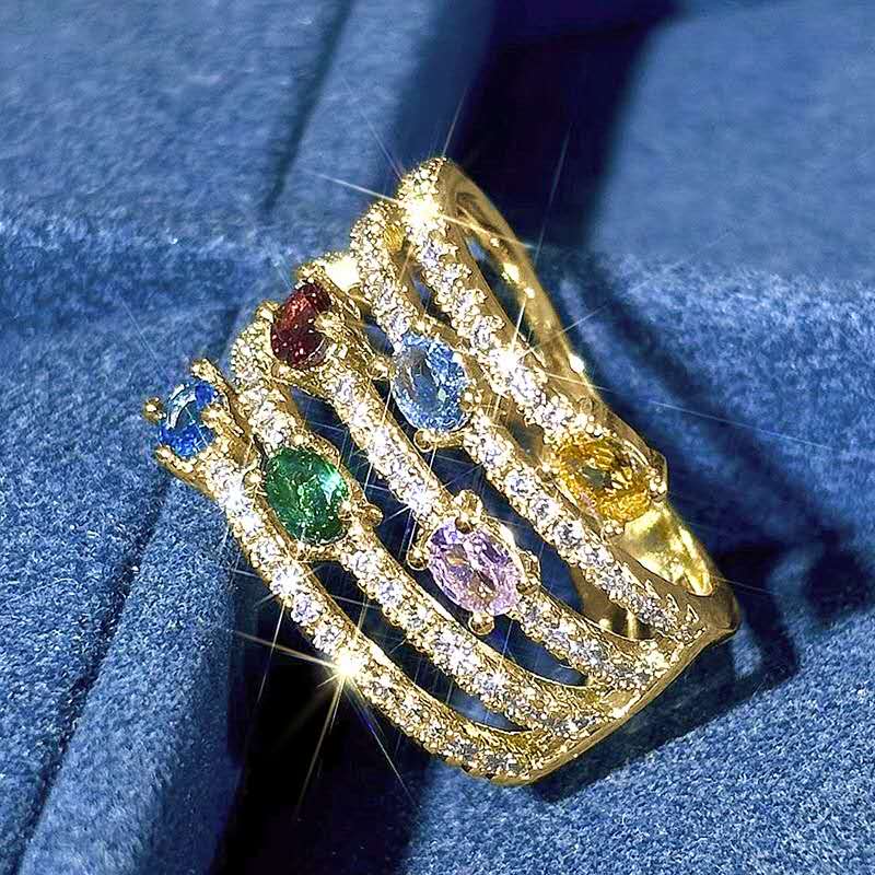 Multi-layered ring with rhinestones and colored cubic zirconia