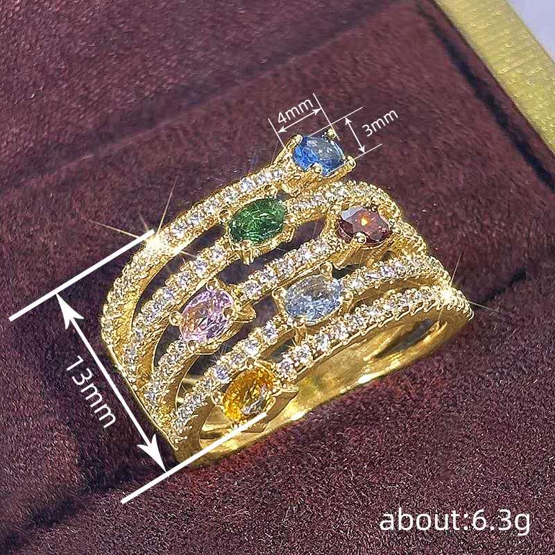 Multi-layered ring with rhinestones and colored cubic zirconia