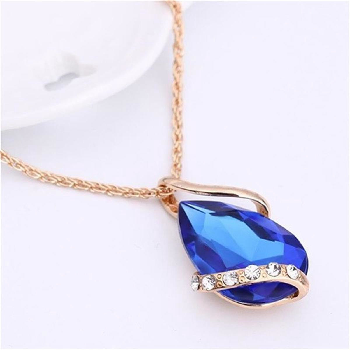 Parure de bijoux comprenant un collier avec pendentif en forme de goutte d'eau en cristal bleu et des boucles d'oreilles pendantes, en alliage de zinc hypoallergénique