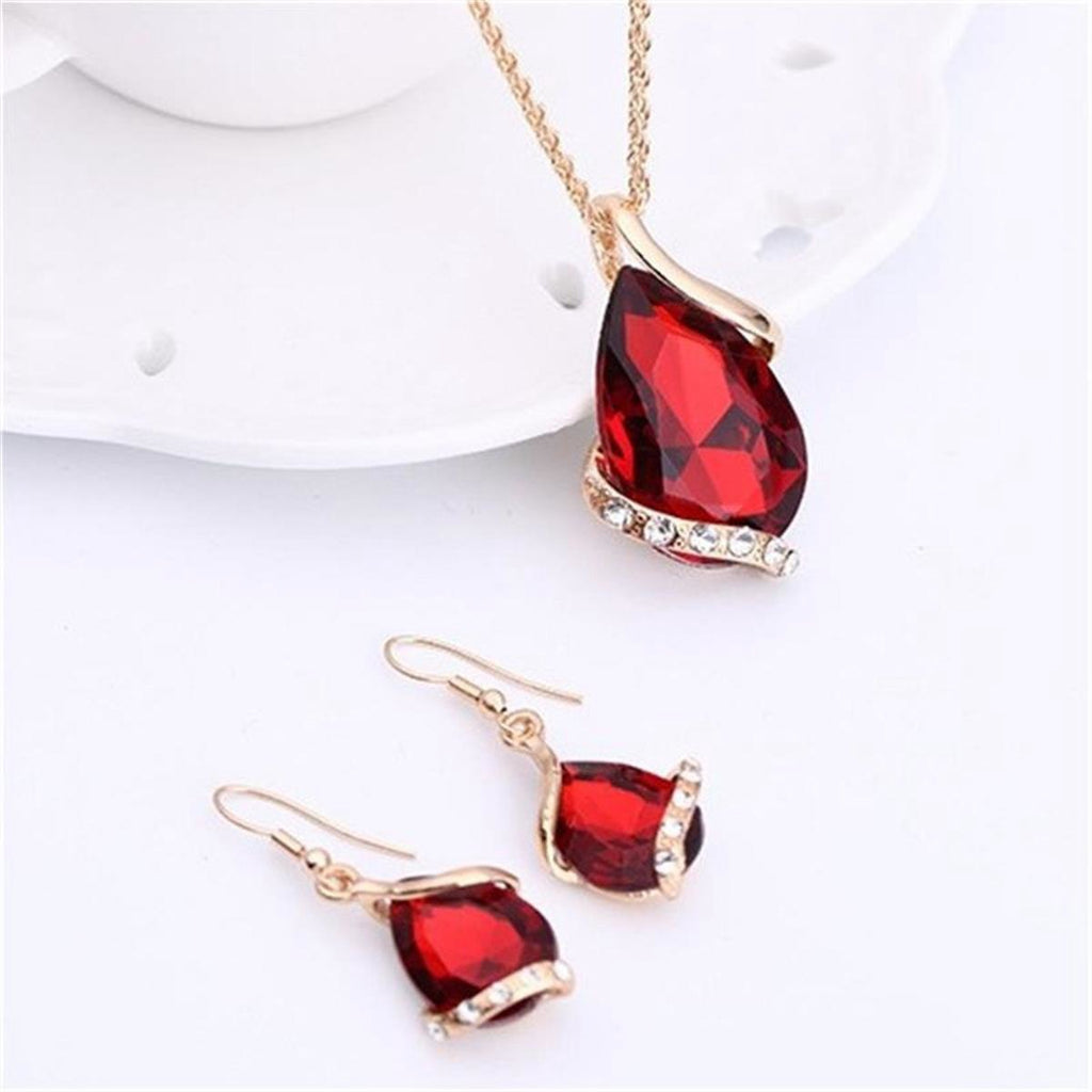 Parure de bijoux comprenant un collier avec pendentif en forme de goutte d'eau en cristal bleu et des boucles d'oreilles pendantes, en alliage de zinc hypoallergénique