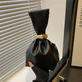 New women's retro pleated bag: a stylish, minimalist, and unique bucket bag featuring a spacious interior and an elegant aesthetic.
