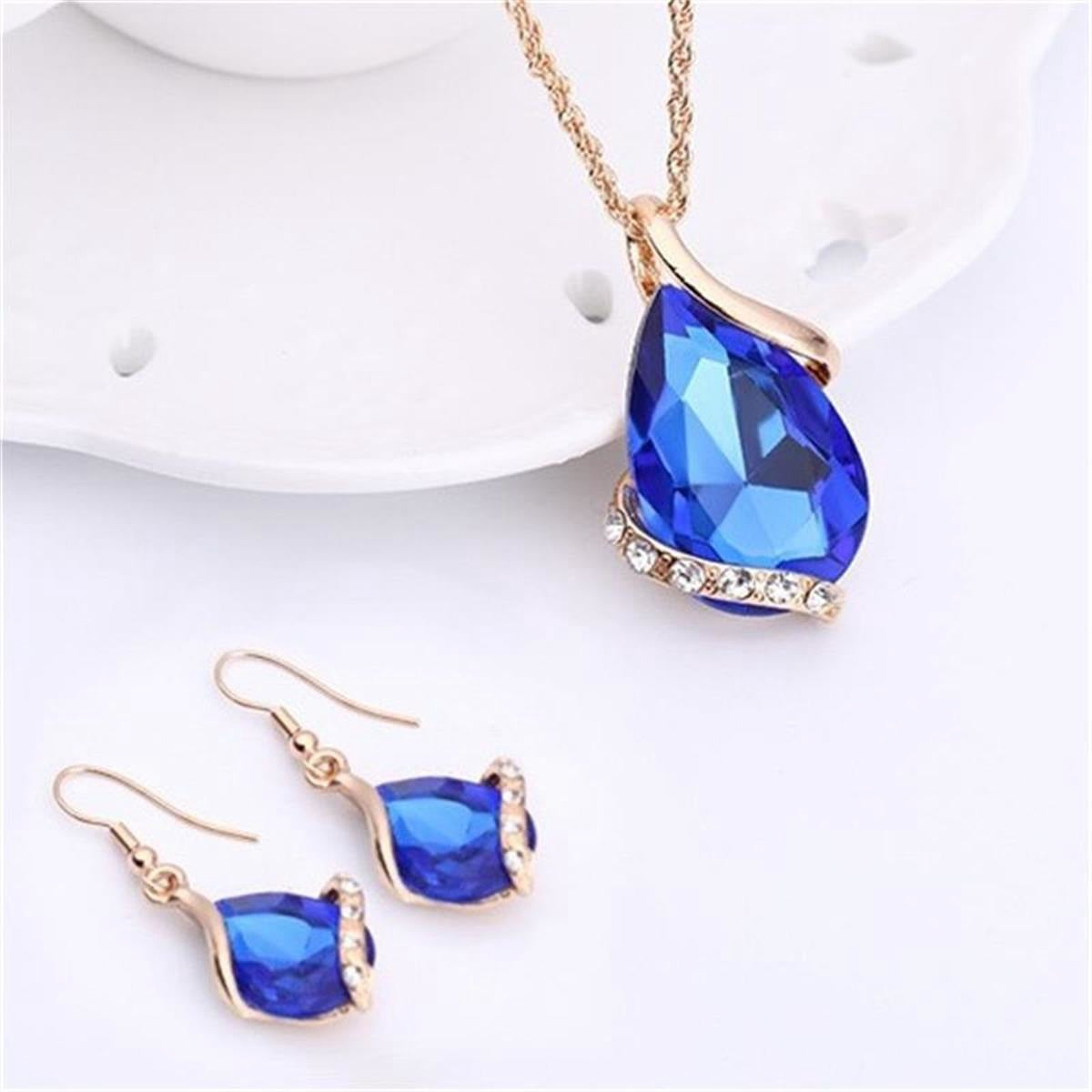 Parure de bijoux comprenant un collier avec pendentif en forme de goutte d'eau en cristal bleu et des boucles d'oreilles pendantes, en alliage de zinc hypoallergénique