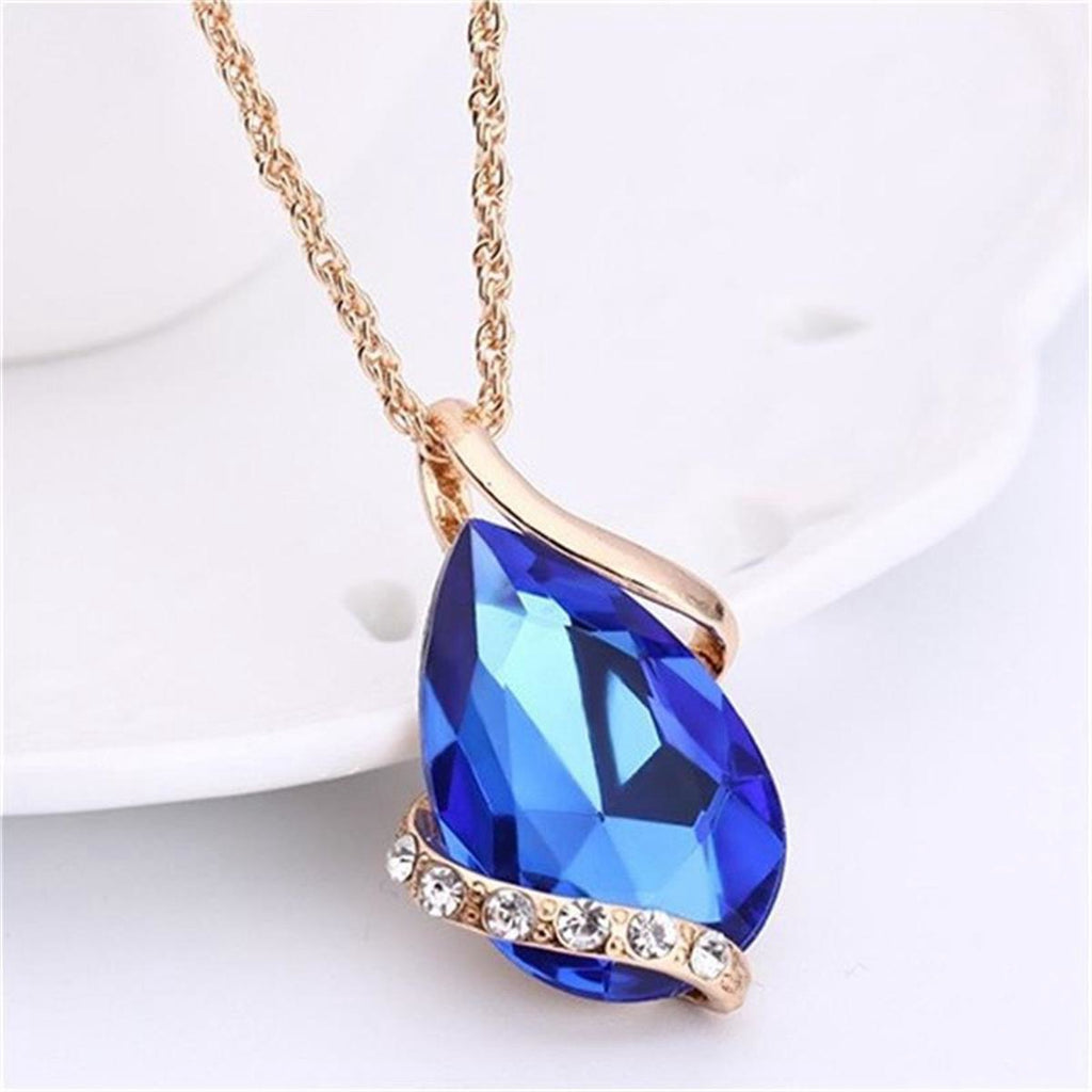Parure de bijoux comprenant un collier avec pendentif en forme de goutte d'eau en cristal bleu et des boucles d'oreilles pendantes, en alliage de zinc hypoallergénique