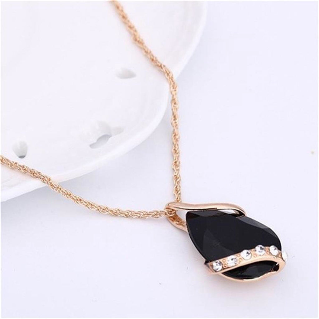 Parure de bijoux comprenant un collier avec pendentif en forme de goutte d'eau en cristal bleu et des boucles d'oreilles pendantes, en alliage de zinc hypoallergénique