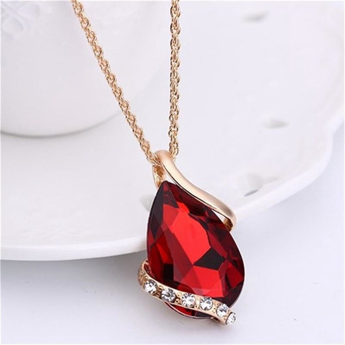 Parure de bijoux comprenant un collier avec pendentif en forme de goutte d'eau en cristal bleu et des boucles d'oreilles pendantes, en alliage de zinc hypoallergénique