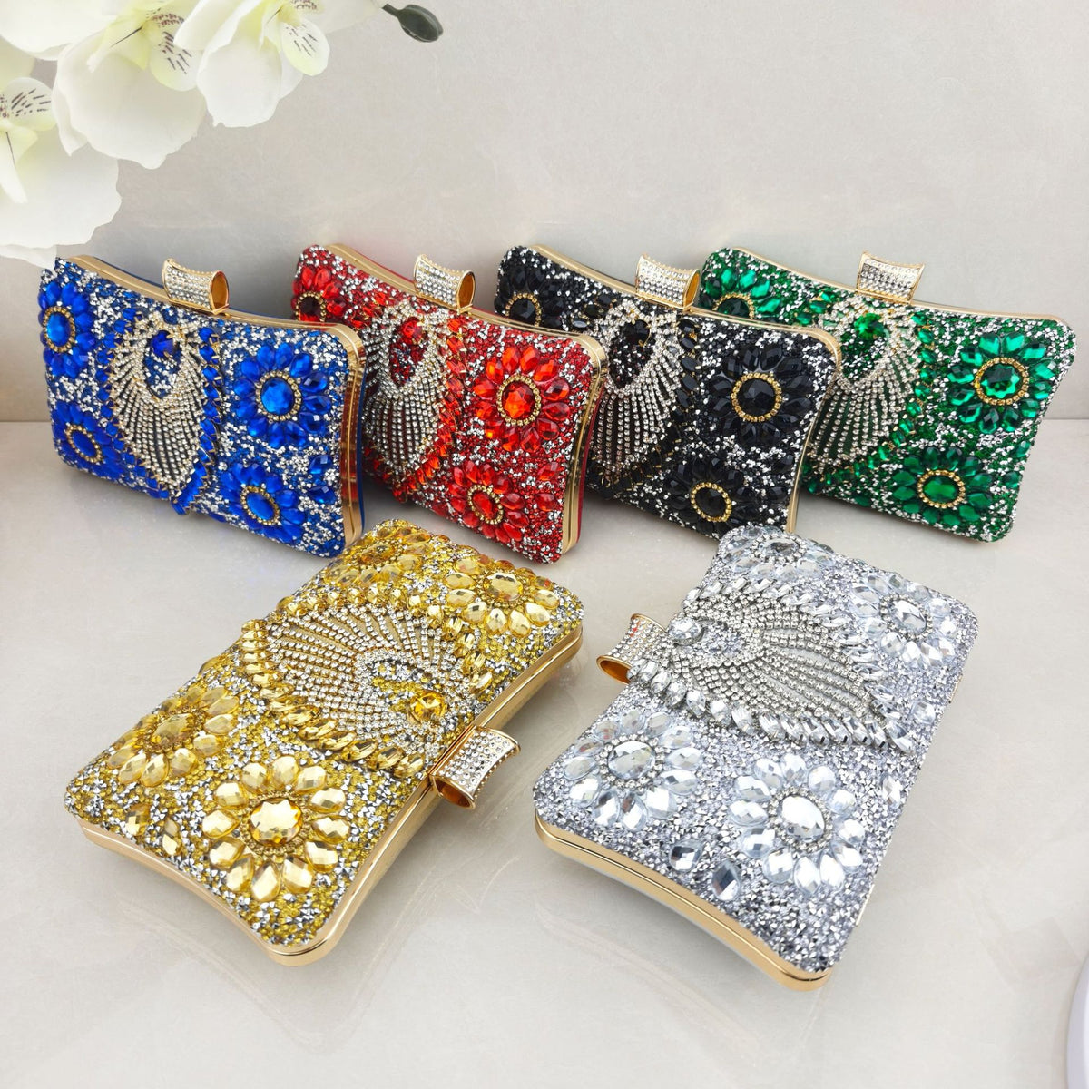 Rhinestone-embellished evening bag—a small, structured handbag/clutch suitable for formal events, featuring options for handheld, crossbody, or clutch carry.