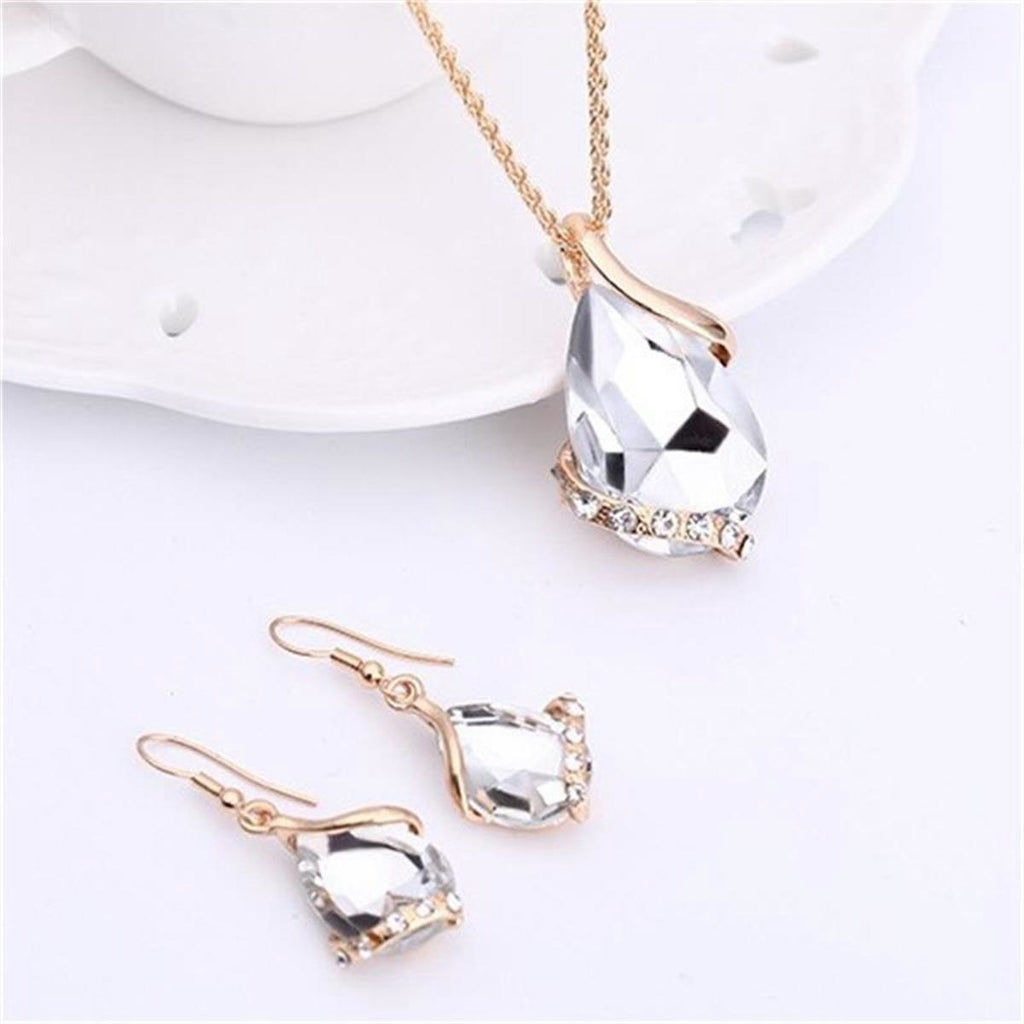 Parure de bijoux comprenant un collier avec pendentif en forme de goutte d'eau en cristal bleu et des boucles d'oreilles pendantes, en alliage de zinc hypoallergénique