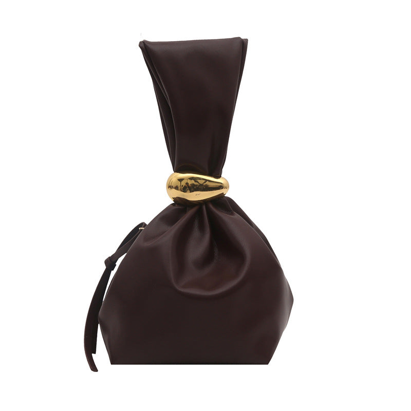 New women's retro pleated bag: a stylish, minimalist, and unique bucket bag featuring a spacious interior and an elegant aesthetic.