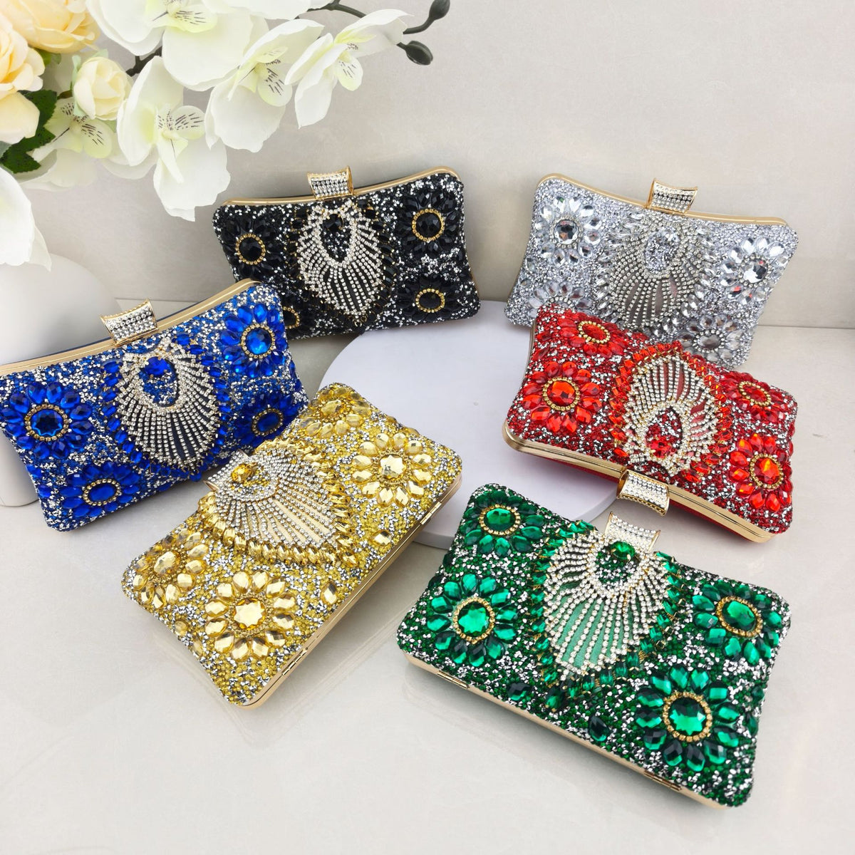 Rhinestone-embellished evening bag—a small, structured handbag/clutch suitable for formal events, featuring options for handheld, crossbody, or clutch carry.