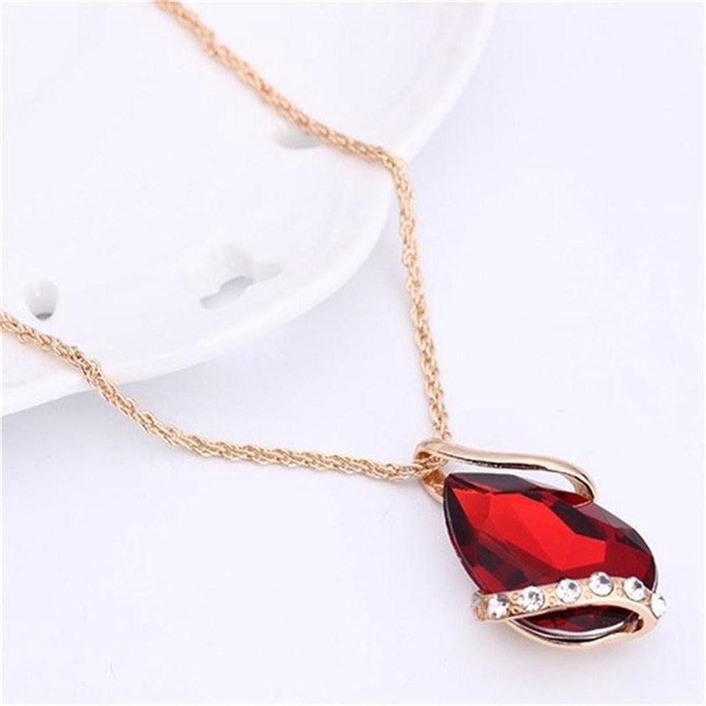 Parure de bijoux comprenant un collier avec pendentif en forme de goutte d'eau en cristal bleu et des boucles d'oreilles pendantes, en alliage de zinc hypoallergénique