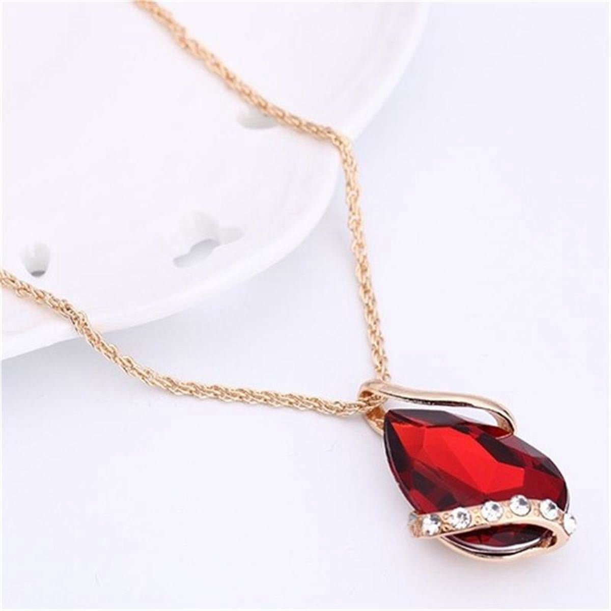 Parure de bijoux comprenant un collier avec pendentif en forme de goutte d'eau en cristal bleu et des boucles d'oreilles pendantes, en alliage de zinc hypoallergénique