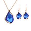 Parure de bijoux comprenant un collier avec pendentif en forme de goutte d'eau en cristal bleu et des boucles d'oreilles pendantes, en alliage de zinc hypoallergénique