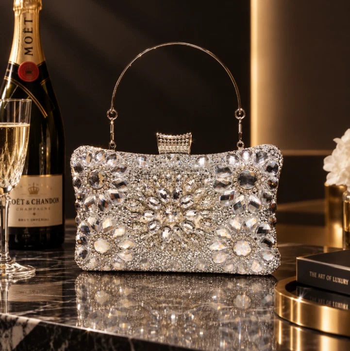 Elegant hard-shell clutch with cubic zirconia and rhinestones.